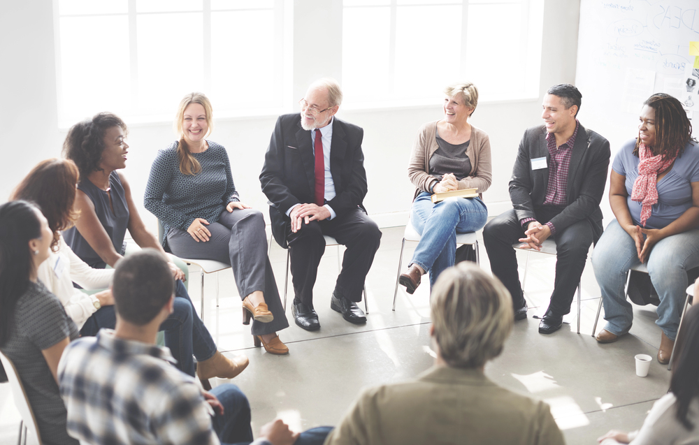 Adults participating in a supportive mental health group discussion