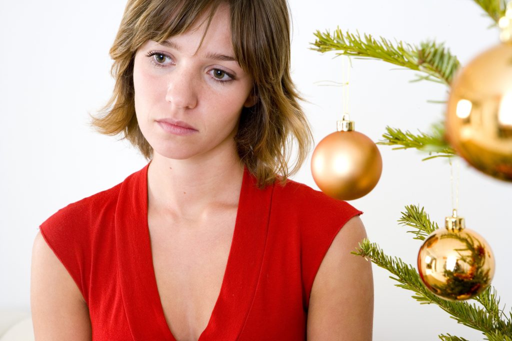 Woman experiencing sadness during the holiday season